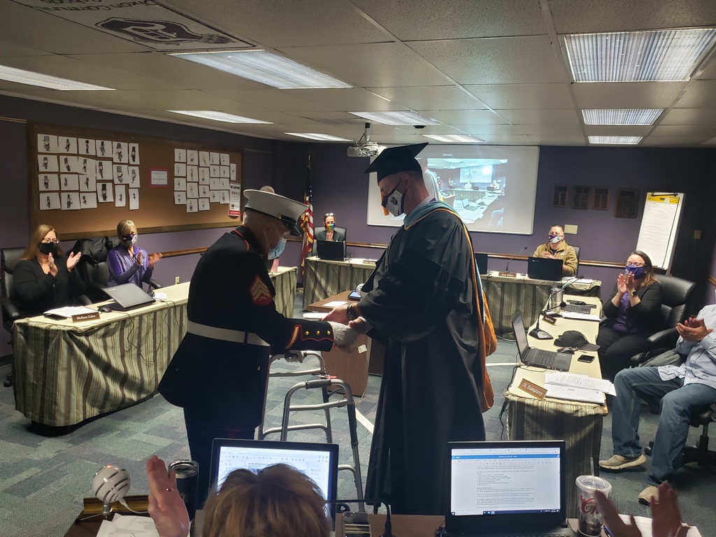 Marvin Younger receives his diploma from Dr. Grady