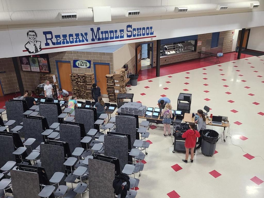 Photo of students setting up computers
