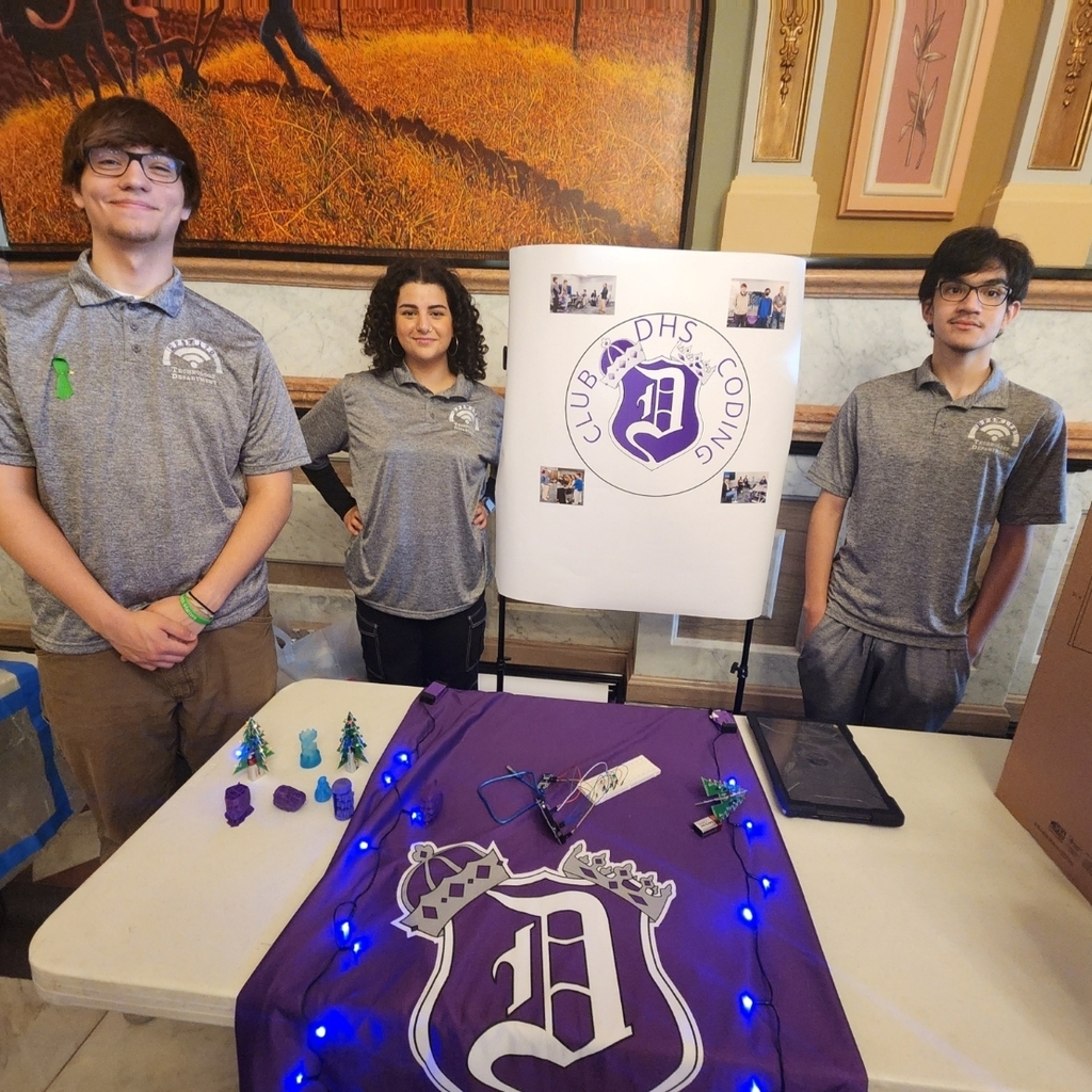 3 students at demonstration table